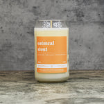 Oatmeal Stout scent soy wax candle in can shaped glass vessel with tapered top and rich orange label